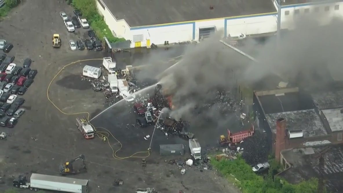 Crews battle fire at West Philadelphia junkyard